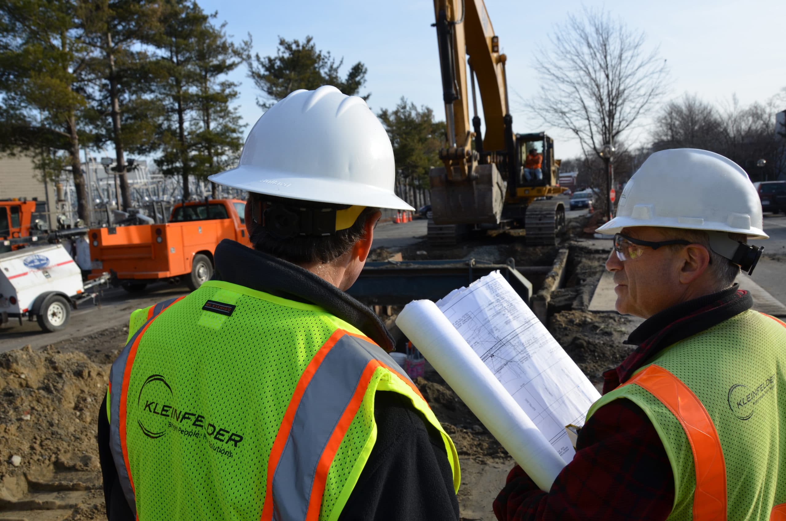 Site Visit Hard Hats 2 two people with high vis vests and hard hats at work site