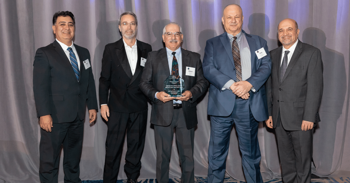 Photo of the team who accepted the award, pictured with members of ACEC CA.