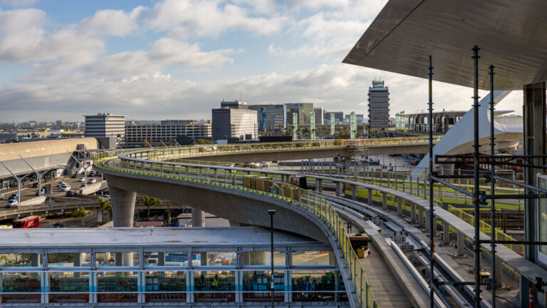 Los Angeles Airport automated people mover train rail overlooking city