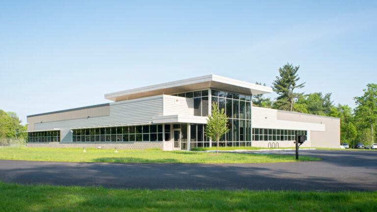 Exterior of water authority building with grass and trees