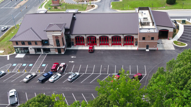 fire station aerial view with parking lot and trees