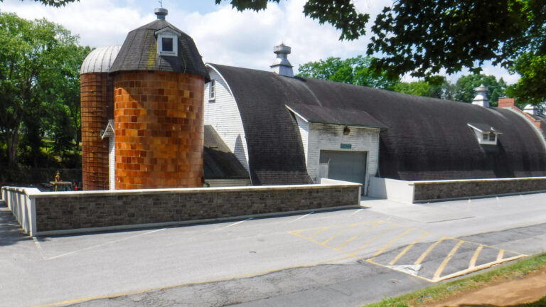 Sheppard Pratt retaining wall from road with barn building