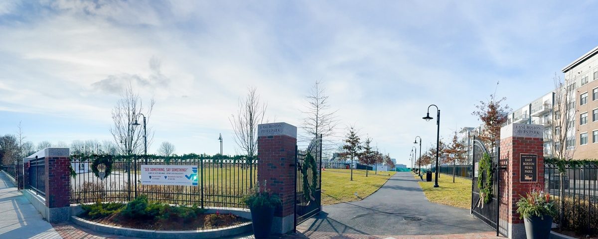 Piers Park 2 park entrance with sidewalk and grass
