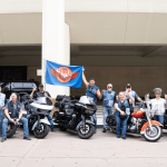 Water Buffalos group posing with motorcycles in Anaheim