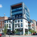 City House Charles full building view at street level with blue sky