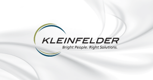 Kleinfelder logo on white marble background