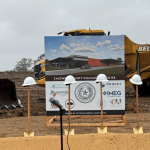 Hard hats on top of shovel handles at groundbreaking event for Caldwell County Evacuation Center project
