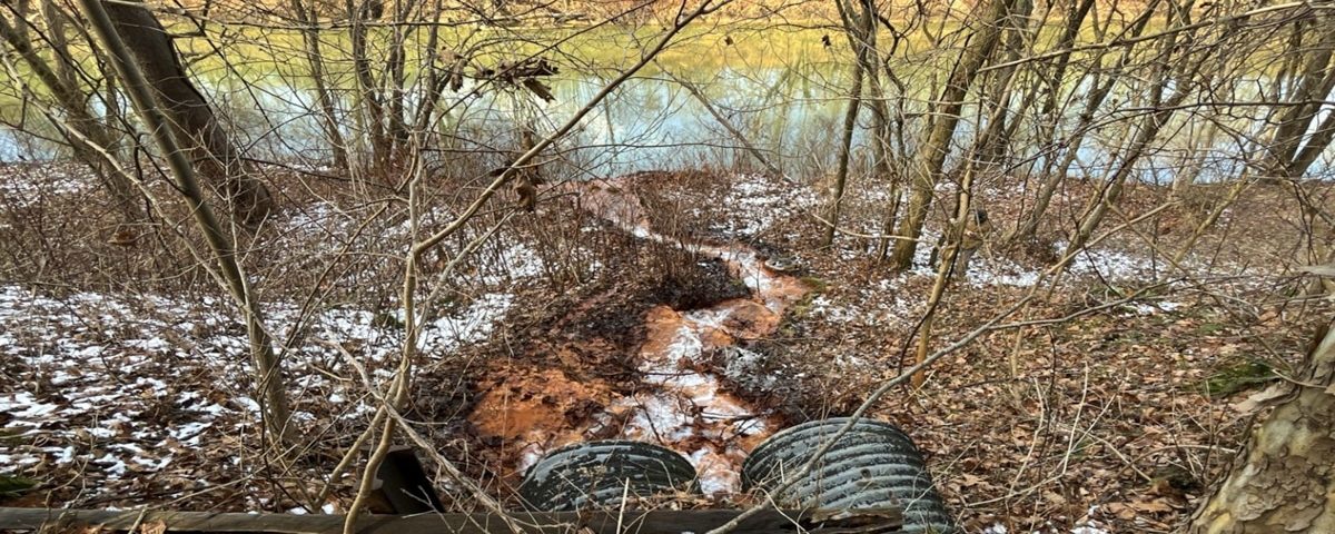 Shinnston drainage with pipes and affected water leading to stream