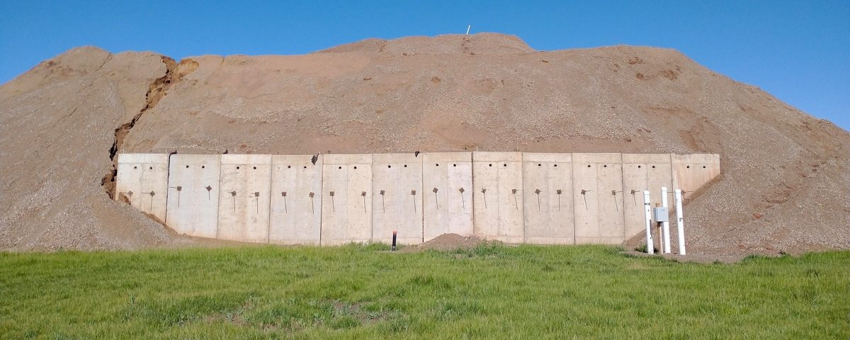 West Davis Corridor project completed test pit with fill soil and green grass
