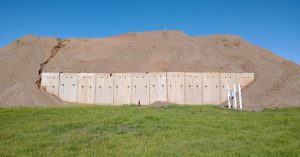 West Davis Corridor project completed test pit with fill soil and green grass