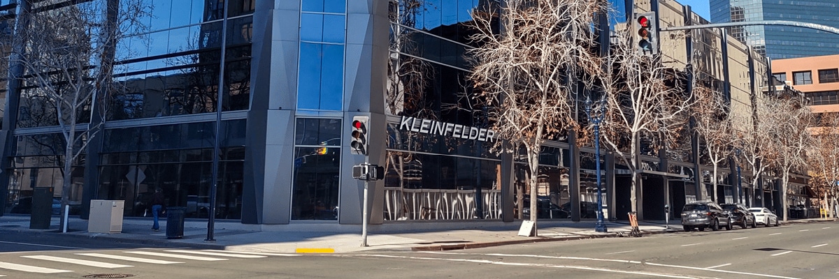 Exterior building view of Kleinfelder San Diego office with sidewalk and trees