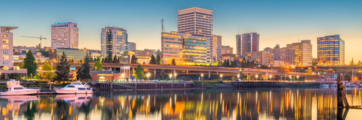 Tacoma, Washington, USA downtown skyline at dusk on Commencement Bay.