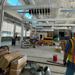 Kleinfelder employee standing in the Bays 1-4 interior at the Napa Valley Transportation Authority Maintenance Building project