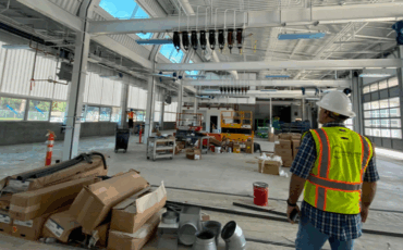 Kleinfelder employee standing in the Bays 1-4 interior at the Napa Valley Transportation Authority Maintenance Building project