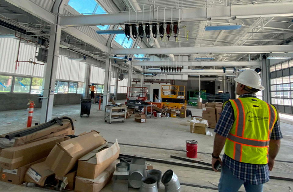 Kleinfelder employee standing in the Bays 1-4 interior at the Napa Valley Transportation Authority Maintenance Building project
