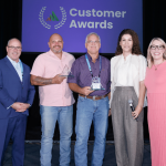 Kleinfelder's Giacomo Zignago (2nd from left) and Mark Hernandez (third from left) accepted the Sustainability Trailblazer Award at the 2025 Avetta Summit