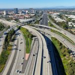 Aerial view of highway transportation with small traffic, highway interchange and junction, San Diego Freeway and Santa Ana Freeway. USU California