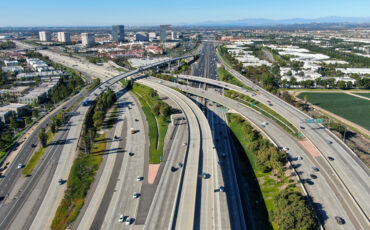 Aerial view of highway transportation with small traffic, highway interchange and junction, San Diego Freeway and Santa Ana Freeway. USU California