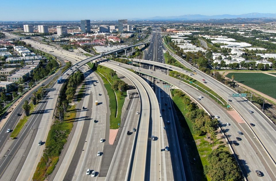 Aerial view of highway transportation with small traffic, highway interchange and junction, San Diego Freeway and Santa Ana Freeway. USU California