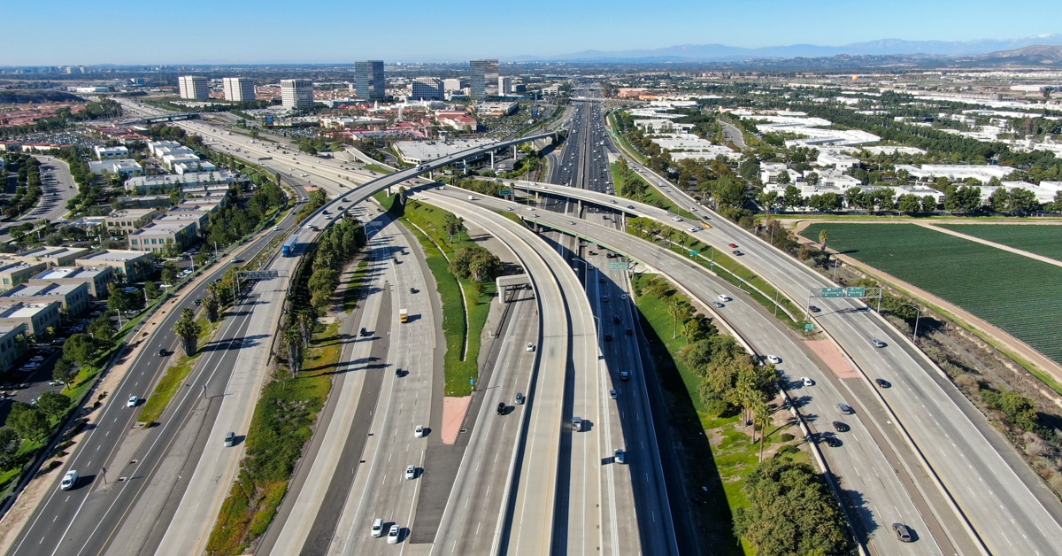 Aerial view of highway transportation with small traffic, highway interchange and junction, San Diego Freeway and Santa Ana Freeway. USU California