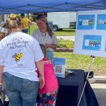 Holly Ridge North Carolina Bee Festival patrons at informational table