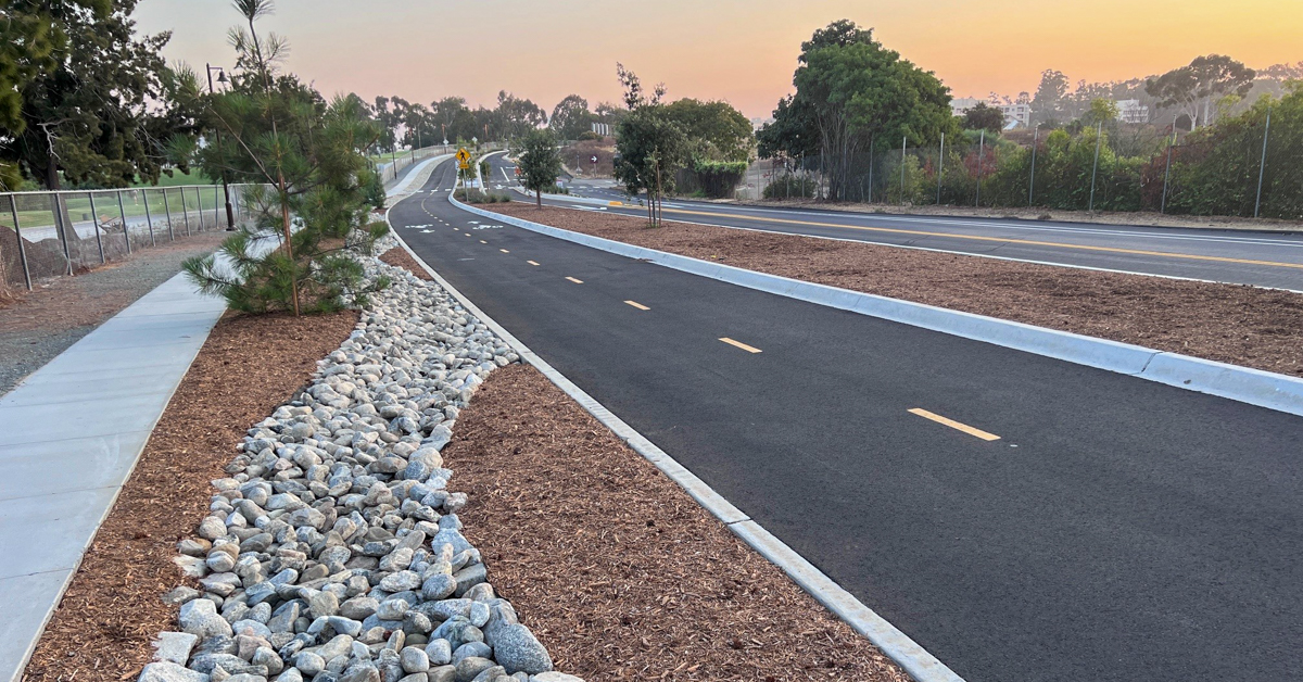 Pershing Drive Bikeway featuring stormwater features and sunset