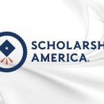 Scholarship America organization logo on white marble background