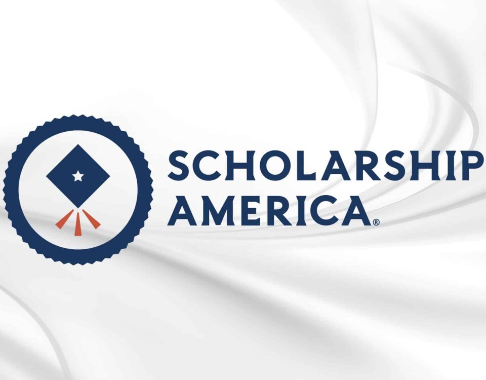 Scholarship America organization logo on white marble background