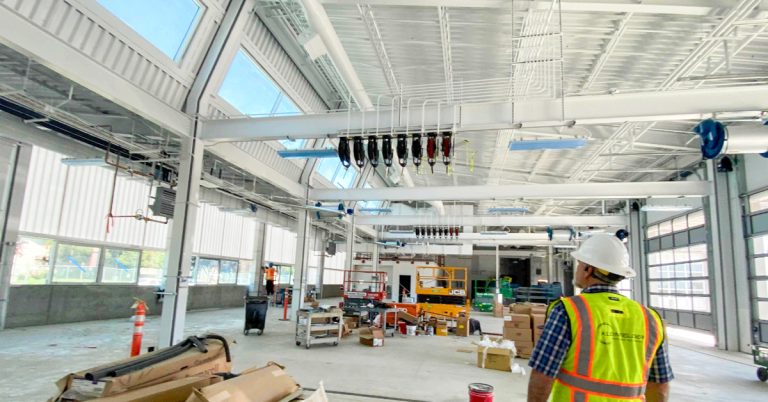 Vine Street Transit construction interior building with person in safety gear