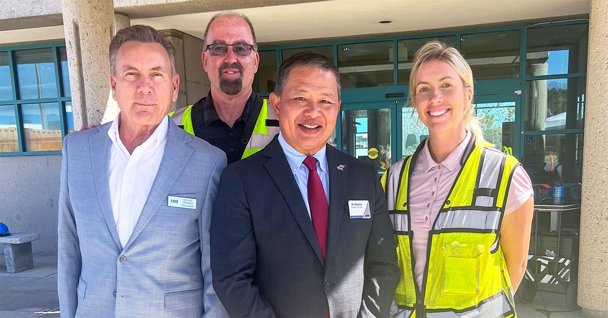 Vic Bianes poses with industry leaders at roadshow event