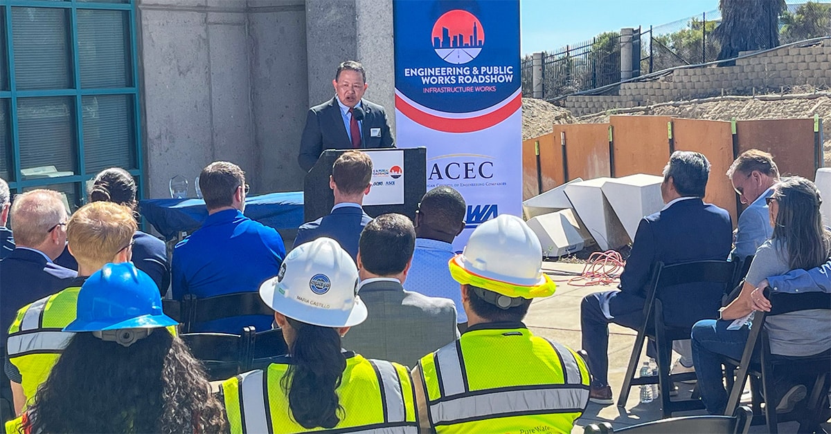 Vic Bianes speaking to crowd at roadshow event