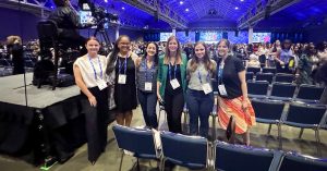 Group poses in auditorium during SWE WE25 event
