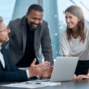 Cropped shot of a group of corporate business colleagues having a meeting around the table in the boardroom.