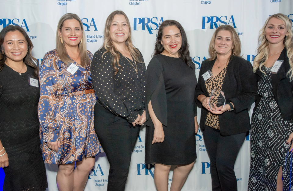 Anna Finlay (KCS), Jennifer Winn (EVMWD), Sylvia Ornelas (EVMWD), Gina Chapa (KCS), Christina Henry (EVMWD), and Haley Munson (EVMWD) receiving the PRSA-IE Polaris Award