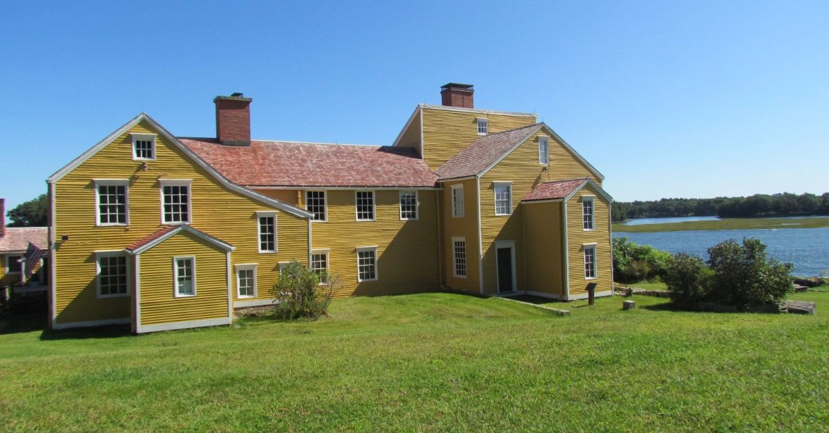 Yellow historic house by the water