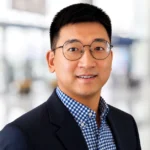 headshot of Chen Chen, Senior Vice President of Corporate Development