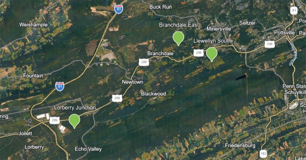 Topographic map with three green pins showing sites of Schuylkill County abandoned mine remediation sites