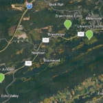 Topographic map with three green pins showing sites of Schuylkill County abandoned mine remediation sites